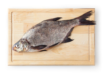 Common river bream on cutting board isolated on white background. Freshwater fish