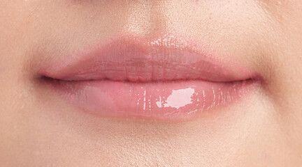 Fototapeta premium closeup Lips, Beautiful young woman with pink lipstick,