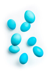 blue easter eggs levitate on a white background with copy space.