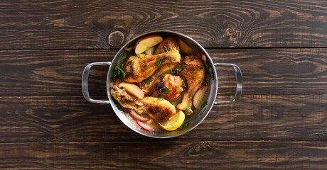 Chicken drumsticks baked with apples and herbs