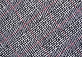 black, white, red tweed with classic check pattern, woven fabric textile background - obrazy, fototapety, plakaty