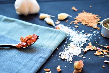 Herbs and spices on dark background