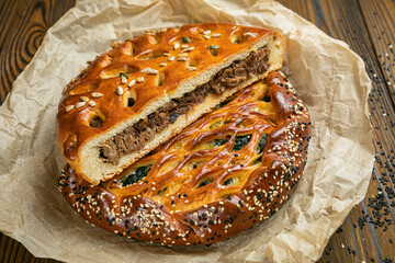 Assorted pies on a brown wooden table  © Борис Яценко