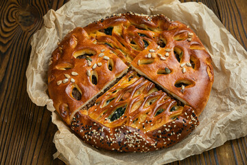 Assorted pies on a brown wooden table  © Борис Яценко