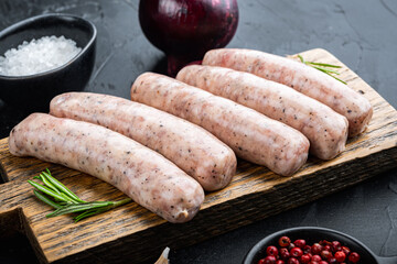 Homemade chicken sausages, on black background