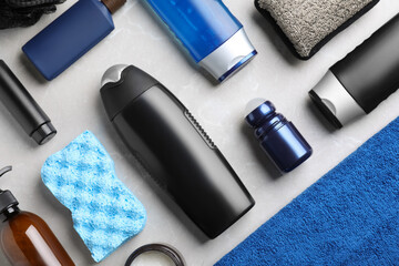 Flat lay composition with men's cosmetics on light grey marble background