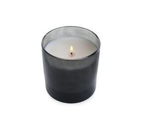 Burning wax candle in holder on white background