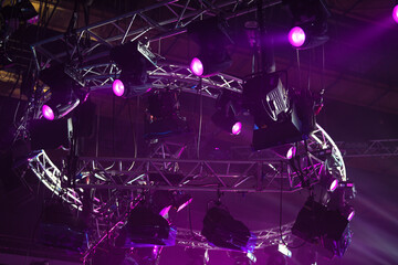 Spot light in the modern television studio on ceiling. Studio lights used for movies and television. Led and fresnell spot lights for concert, tv show, cinema in studio. Lightning system.
