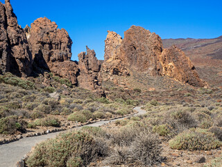 Fototapeta premium Trail around the rock formations at Roques de Garcia in the Teide National Park in Tenerife, Canary Islands, Spain