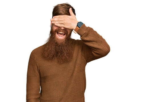 Young irish redhead man wearing casual clothes and glasses smiling and laughing with hand on face covering eyes for surprise. blind concept.