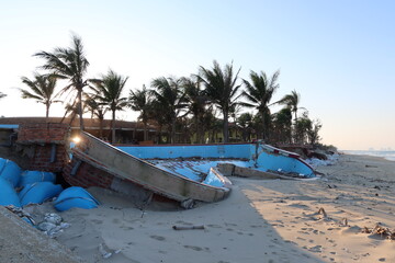 Hoi An, Vietnam, February 13, 2021: Extensive damage to a hotel pool on the central coast of...