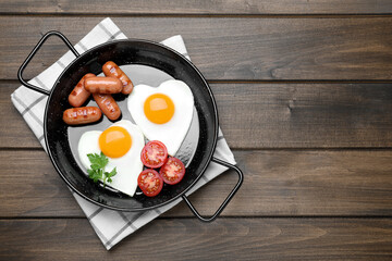 Romantic breakfast on wooden table, top view with space for text. Valentine's day celebration