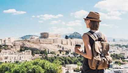 Young woman in Athens with Acropolis at the background. Traveler girl enjoying vacation in Greece....