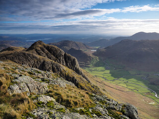 View to Loft Crag from Pike of Stickle overlooking the Great Langdale valley with Blea Tarn nestled...