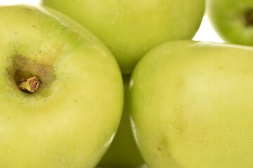 Several organic green apples by Renet Simirenko, close-up.