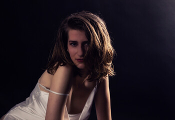 Naklejka premium Sexy young woman close portrait on dark
