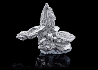 Macro shoot of piece of Pure silver on the black background. Closeup photo of amazing Shiny native...