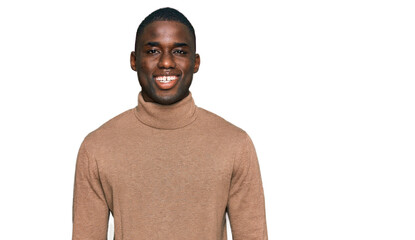Young african american man wearing casual winter sweater with a happy and cool smile on face. lucky person.