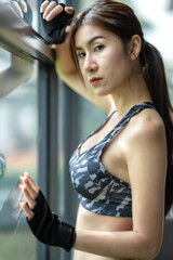 Soft focus consept women are exercising in gym fitness. Beautiful women in good shape from taking care of their bodies. Health concept. 