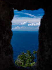 the sea from the aperture.
view of mediterrean sae from an aperture in wall of castle in Populonia. Italy - 413566468
