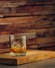 A glass of whiskey with ice