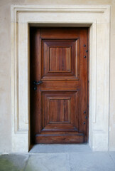 Obraz na płótnie Canvas external wooden entrance doors to houses