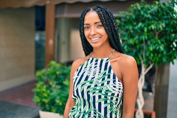 Young african american woman smiling happy walking at the city.
