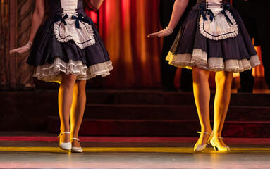Closeup of  ballerinas dancing in chambermaid costumes