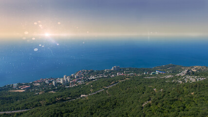 Foros, Crimea. View from the mountain Kyzyl-Kaya to Foros settlement, Southern coast of Crimea with sun ray and glare