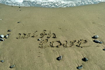 Words With Love on beach sand  