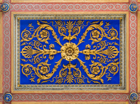 Golden flowery decoration on the ceiling of the Basilica of San Nicola in Carcere in Rome, Italy.