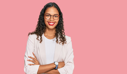 Young african american girl wearing business clothes happy face smiling with crossed arms looking...