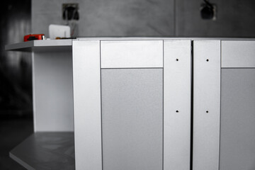 Lower custom kitchen cabinets installation with a furniture facades mdf. Gray modular kitchen from...