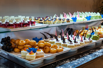 Open buffet full of delicious fruits with orange, grape, watermelon