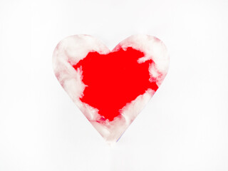 The perforated white paper is a red heart-shaped with white cotton wool around it. Communicate pure love