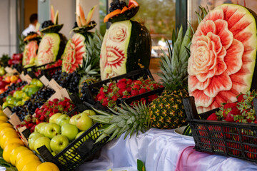 Open buffet full of delicious fruits with orange, grape, watermelon