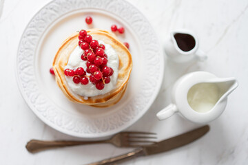 American Peanut Pancakes with Cranberries, Maple Syrup and Yoghurt , Morning Flat Lay
