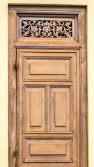 The door of an old house with an ornament in the upper part on in Sri Lanka