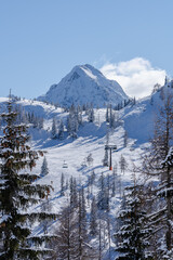Fototapeta na wymiar Winter view in a ski resort in Austria on a sunny day