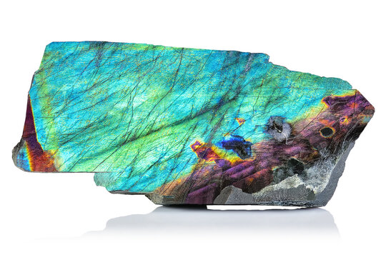 Sample of Amazing rare colorful iridescence Blue Labradorite/Spectrolite gemstone rough or geode. Aurora Borealis mineral stone closeup on white background. Beautiful piece of expensive Crystal