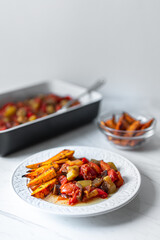 Vegetable Casserole With Chopped Tomatoes, Red Peppers, Zucchini, Eggplant served with Baked Sweet Potatoes