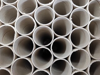 selective focus, unprinted cardboard tubes for brochures.