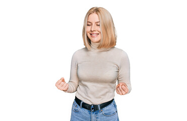 Fototapeta premium Young blonde woman wearing casual clothes very happy and excited doing winner gesture with arms raised, smiling and screaming for success. celebration concept.