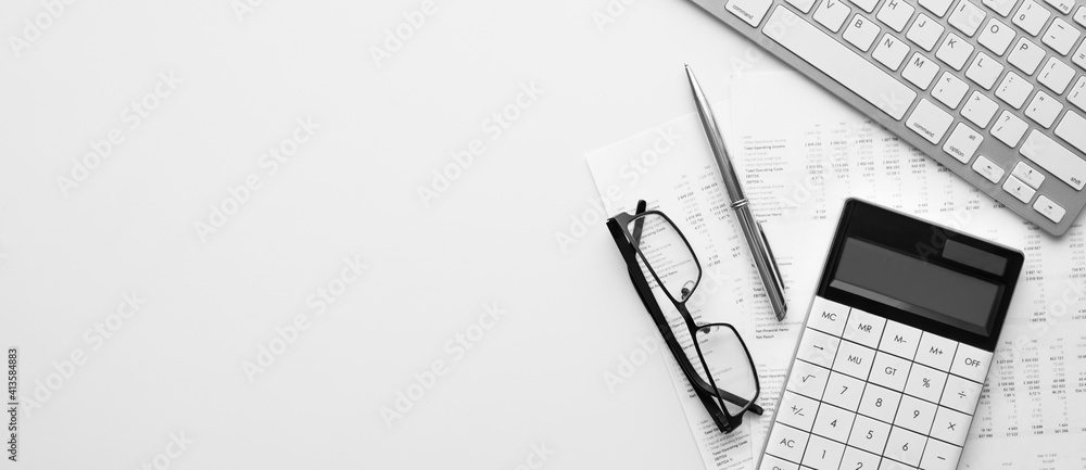 Poster calculator on financial statement and balance sheeet on desk of auditor. concept of accounting and a