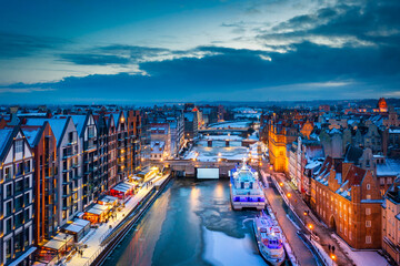 Beautiful old town in Gdansk over Motlawa river at winter dusk, Poland © Patryk Kosmider