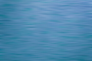 Naklejka premium Blurred blue background water, lake, sea. 