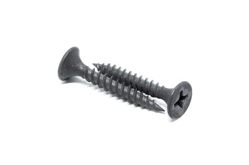 Pair of black steel screws on white background. Isolated objects
