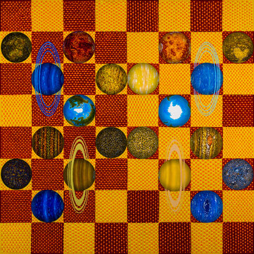 The sun = a chessboard.
Planets = chess pieces.
The planets have a dark and bright side.
The symbol of the struggle of the dark and light side in the solar system.