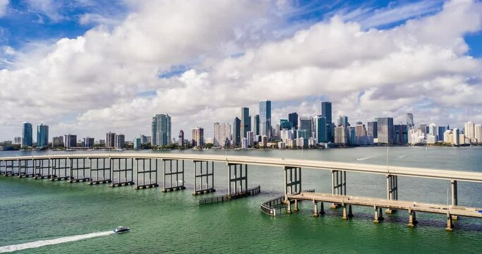 Aerial 4k hyperlapse Brickell Bay Miami Rickenbacker Causeway fast rolling clouds
