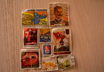 various old stamps are on the table